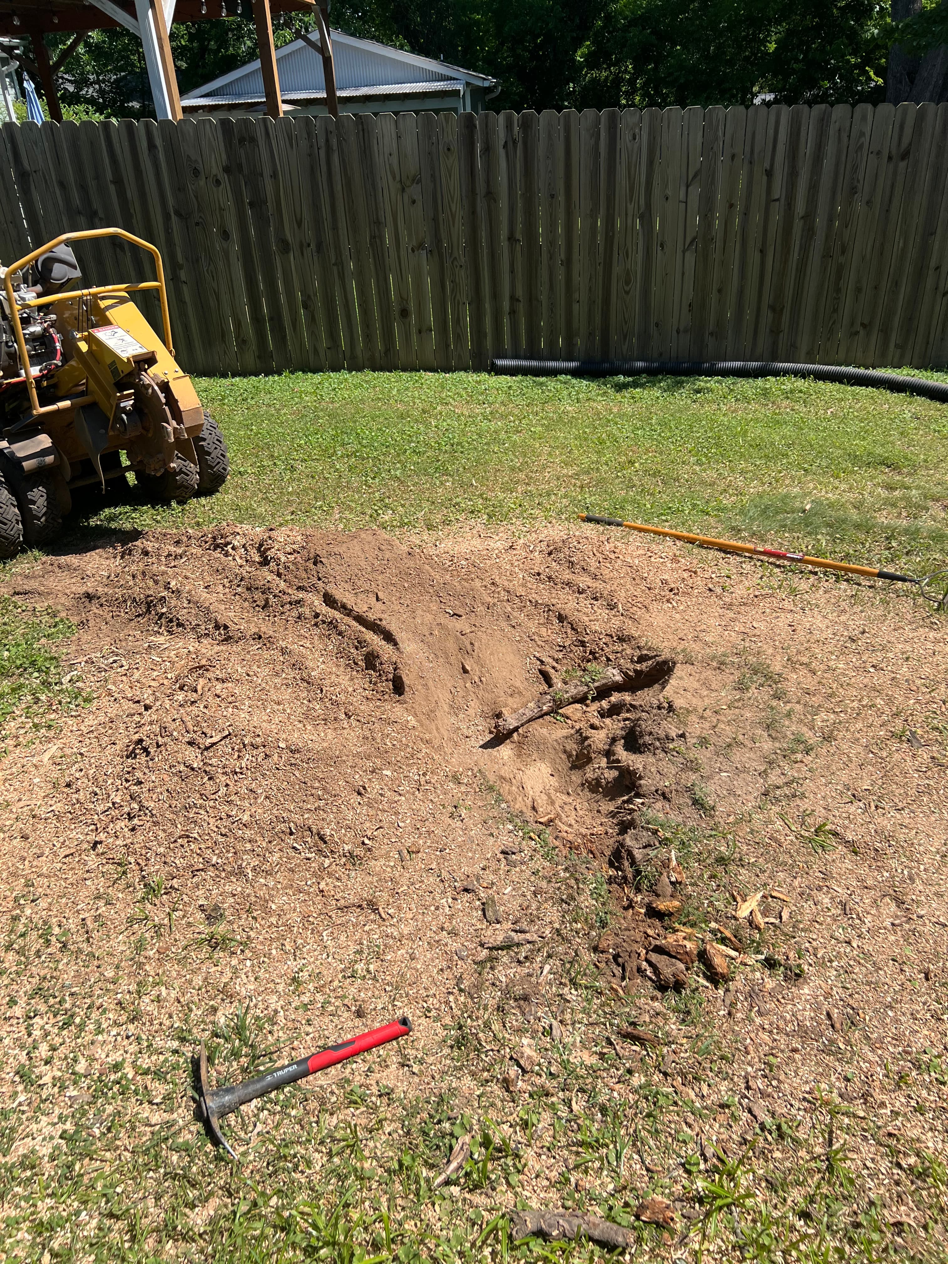 Wheeled arborist stump grinder completing a root flare removal sweep in Chattanooga, TN
